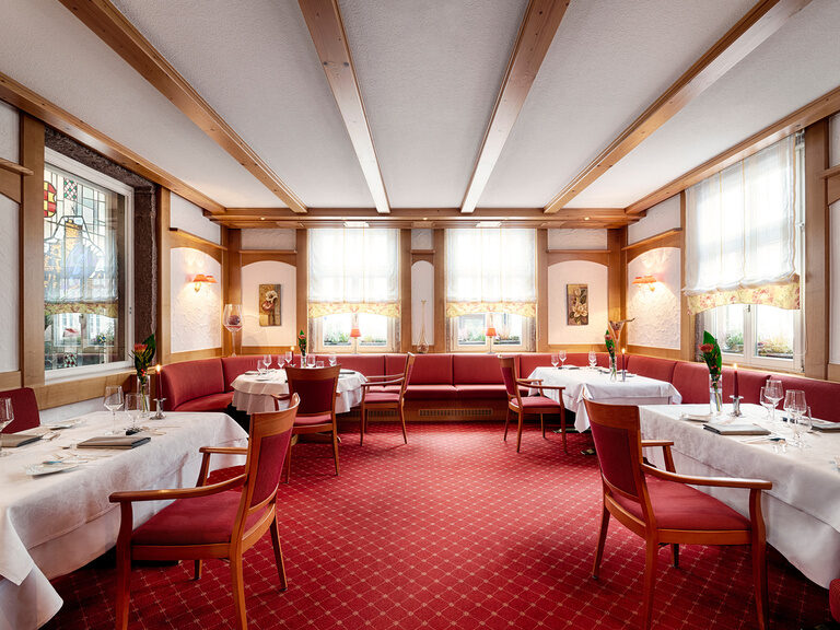 Traditionally furnished red room of the gourmet restaurant Berlins Krone.